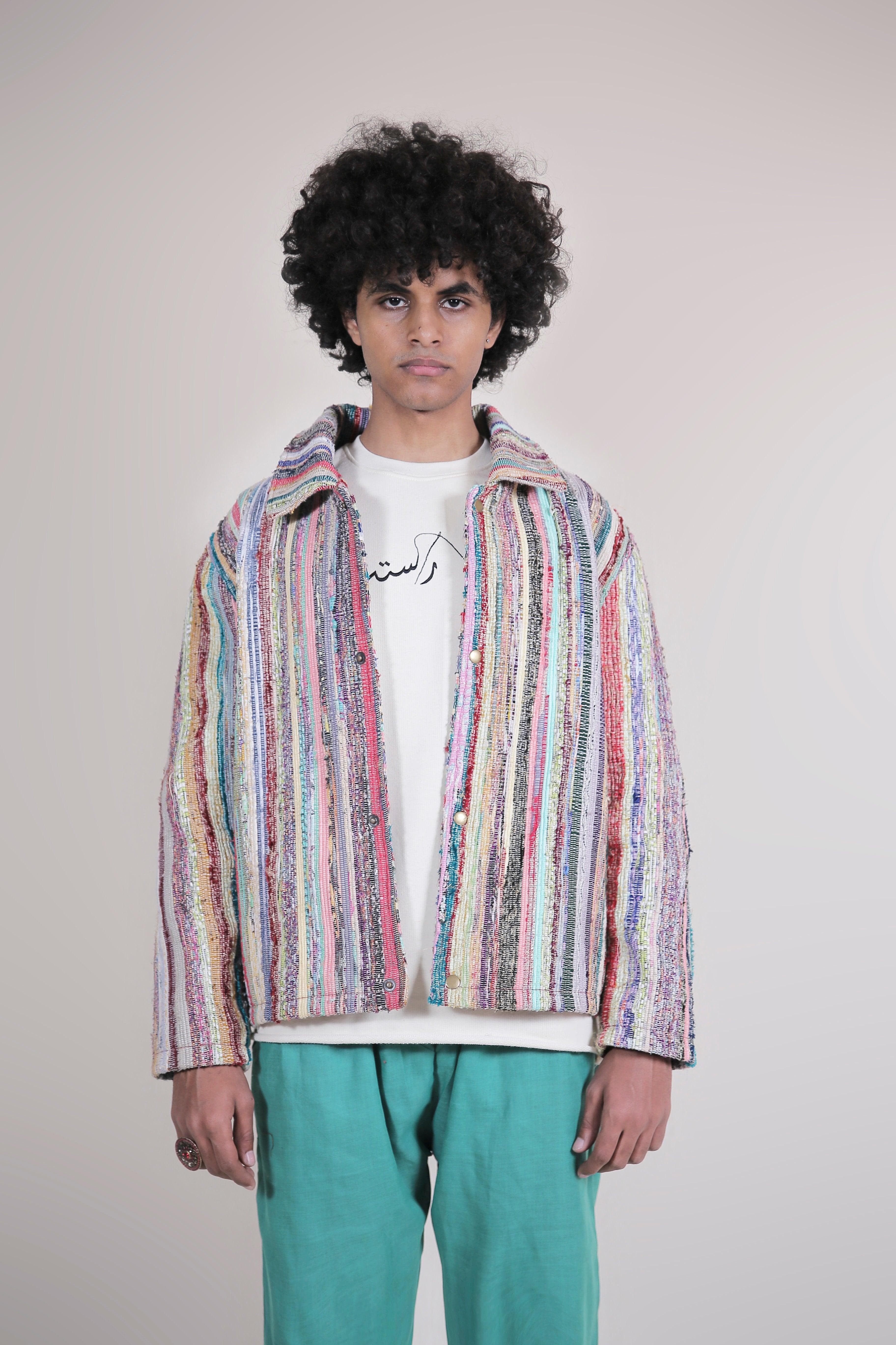 a man wearing a UPCYCLED JACKET by Rastah collection